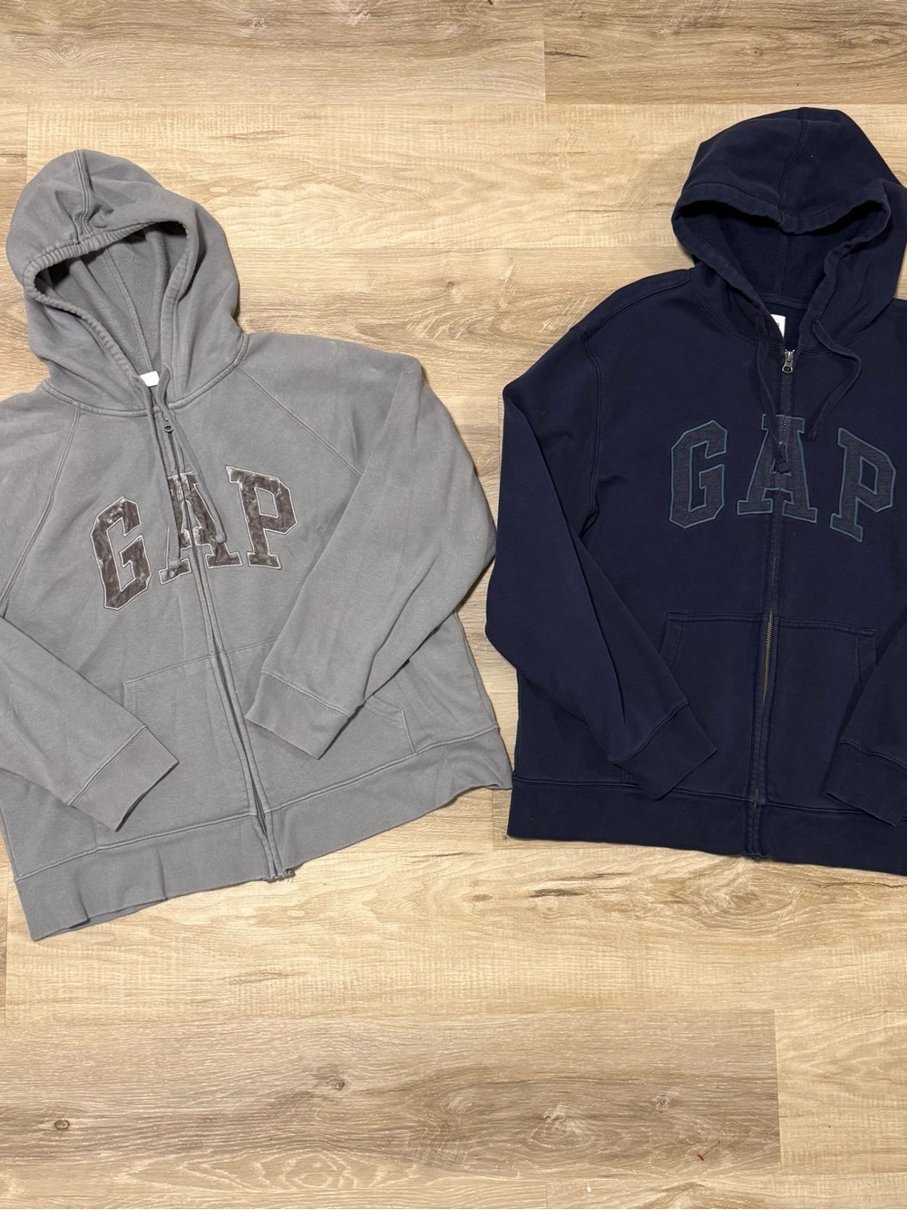 Two GAP Men’s XL Zip Up Hoodies in Gray/Silver and Navy